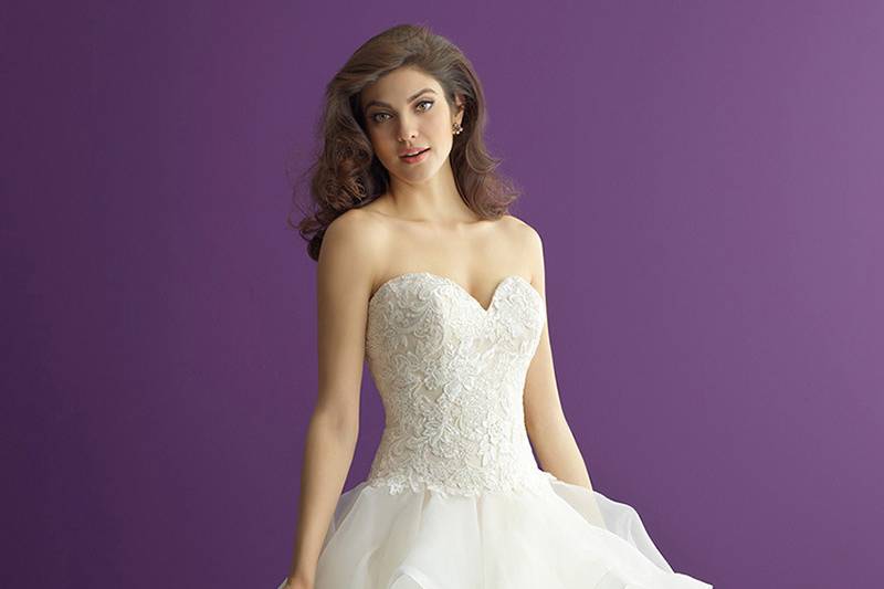 Style 2954 <br> The highlight of this strapless lace gown is an incredible train.