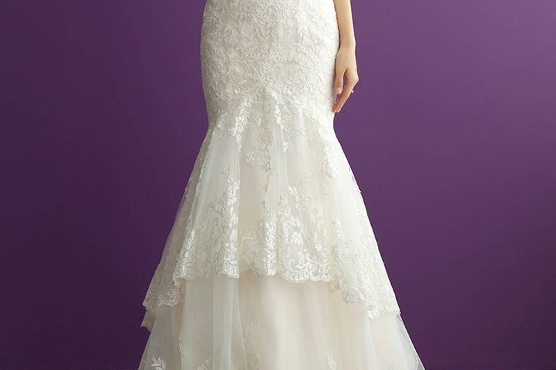 Style 2956 <br> This slim-fitting, sleeveless lace gown is both striking and flattering.