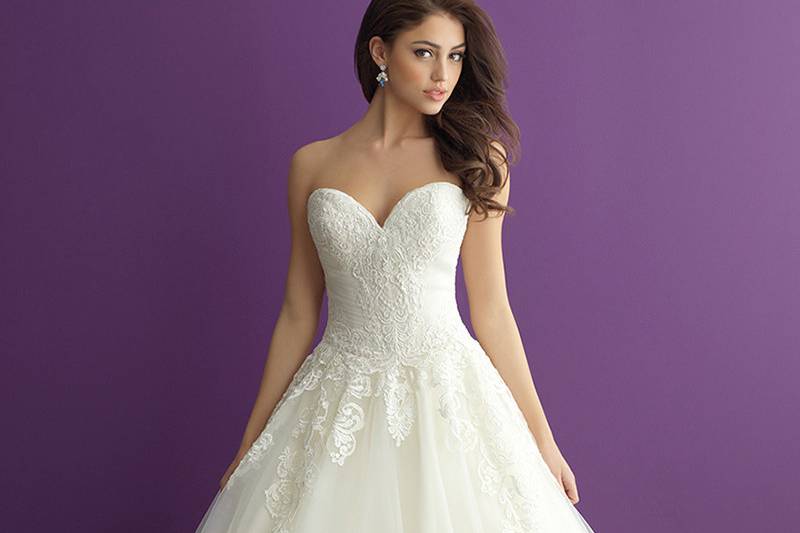 Style 2960 <br> Vintage-inspired lace is featured along the bateau neckline and V-back of this sheath bridal gown.