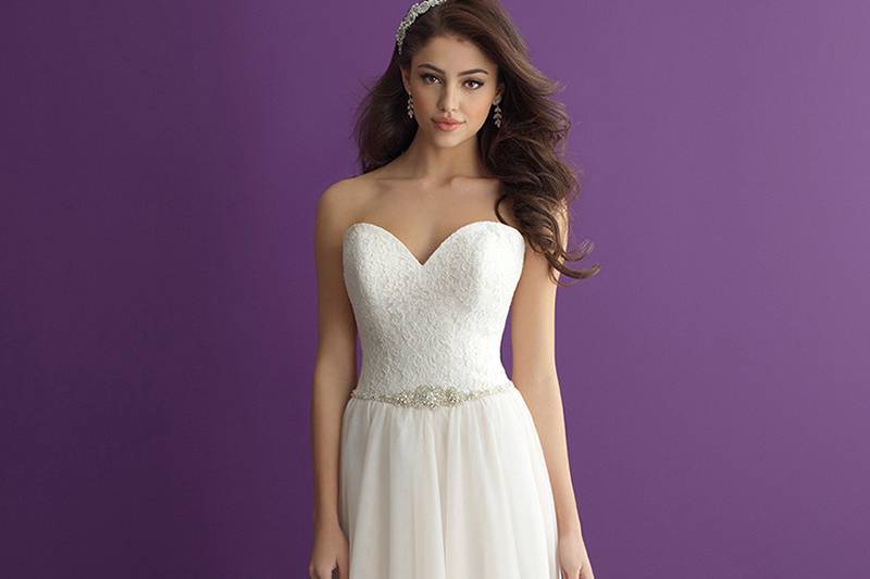 Style 2962 <br> In this slim, A-line gown, cntrasting textures meet at a beaded belt.