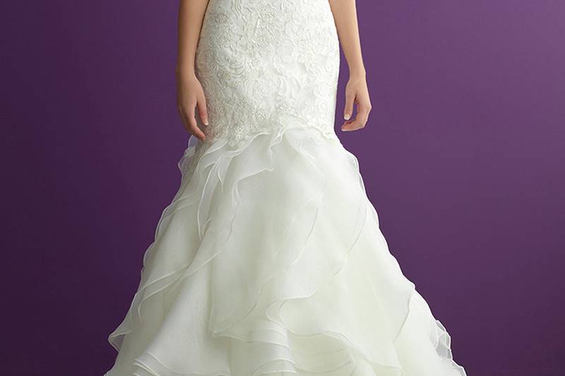 Style 2964 <br> Softly layered ruffles compose the skirt of this strapless mermaid gown.