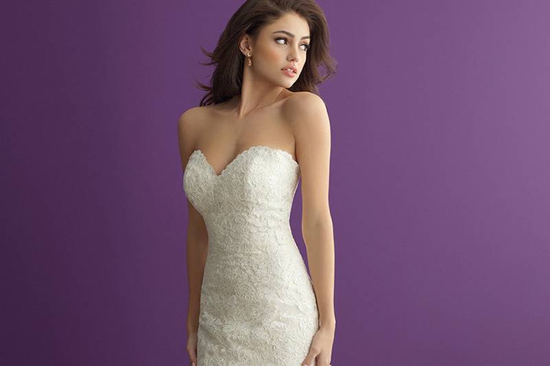 Style 2965 <br> Just above the knee, this structured lace gown flares to a gorgeous tiered train.