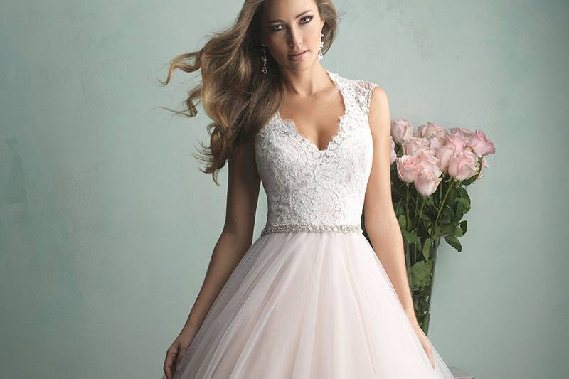 Style 9104 <br> This lace gown features contour straps and gorgeous Swarovski crystal beading at the neckline. 