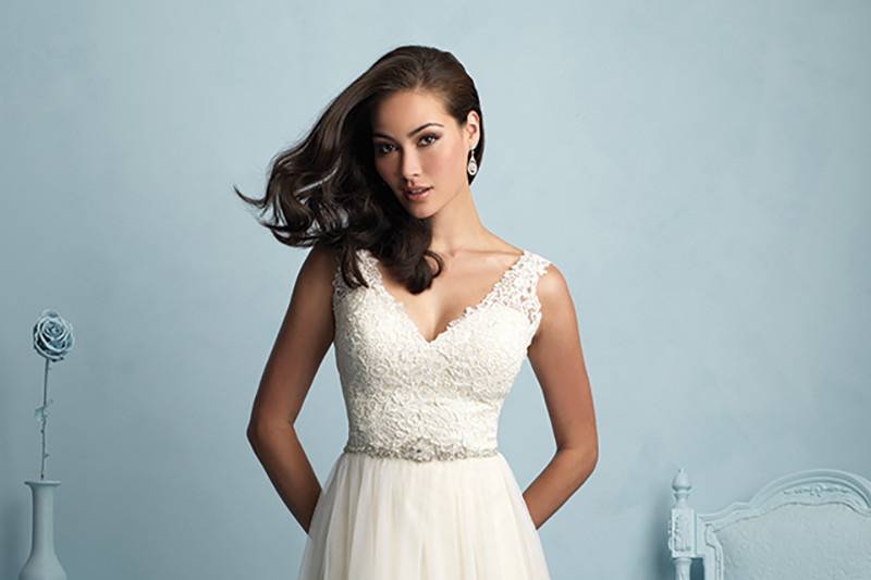 Style 9205 <br> This gown sweetly pairs lace and fluid tulle for an effortlessly beautiful bridal look. 
