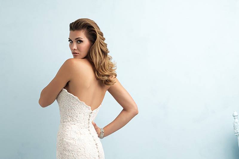 Style 9215 <br> Multitextured lace composes this strapless gown's dramatic train.