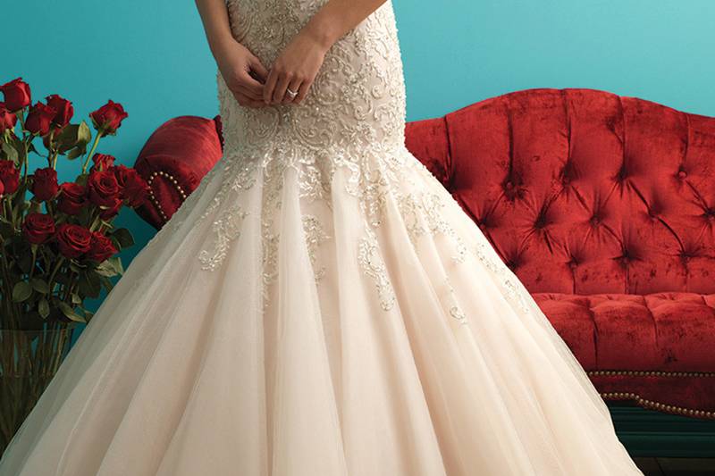 Style 9275 <br> The bodice of this gown is topped with delicate lace appliqué and beading, followed by a mermaid train of English net. 