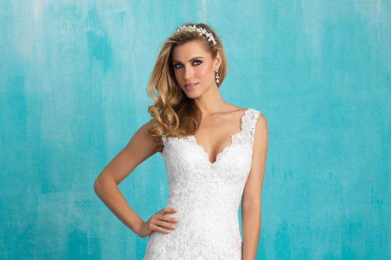 Style 9275 <br> The bodice of this gown is topped with delicate lace appliqué and beading, followed by a mermaid train of English net. 