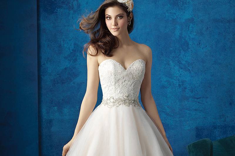 Style 9351 <br> Sparkling asymmetry draws the eye to this strapless ballgown's full skirt.