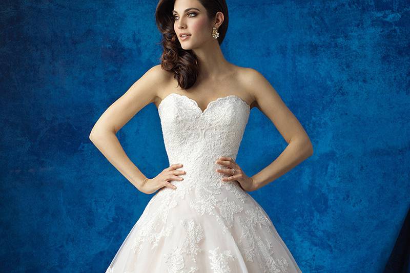 Style 9354 <br> With a perfect train and slight V-back, this lace sheath is subtle but impactful.