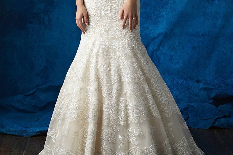 Style 9365 <br> Textured lace appliques elevate this strapless gown into a thing of beauty.