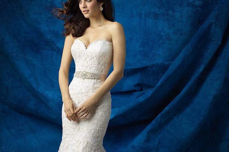 Style 9367 <br> A delicate cap sleeve and patterned back add something special to this curve-hugging lace gown.