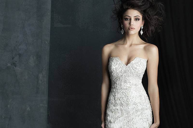 Style C383F <br> Embroidered appliques and beadwork accent the slim silhouette of this strapless gown.