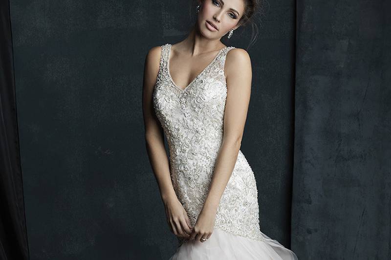 Style C386F <br> Softly tiered ruffles compose the skirt of this beaded sleeveless gown.