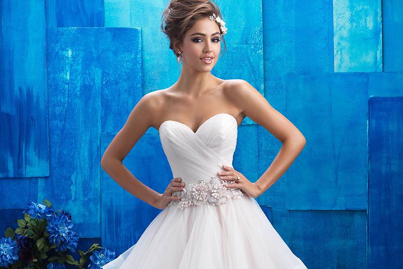 9408	<br>	The sheer ruffles adorning this gown's ballgown skirt are both fluid and structured, topped with a floral belt.