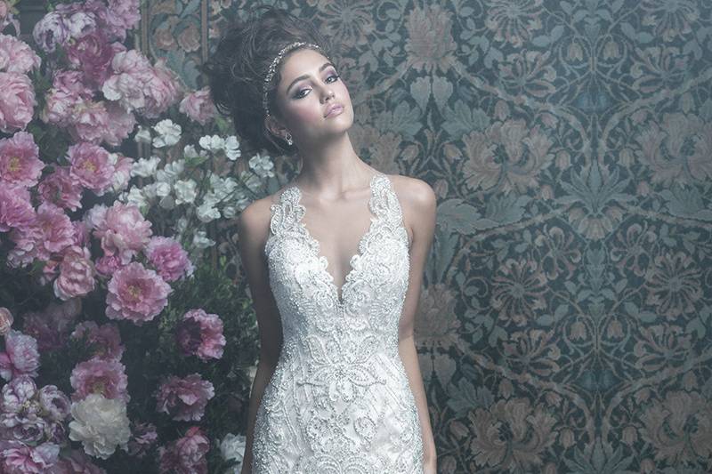 C402	<br>	Swirling Swarovski beaded appliques lend a butterfly-like air to this fit-and-flare gown.