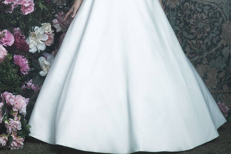 C411	<br>	This ballgown's satin skirt is complemented with decadent Swarovski beadwork along the bodice for a subtle touch of sparkle.