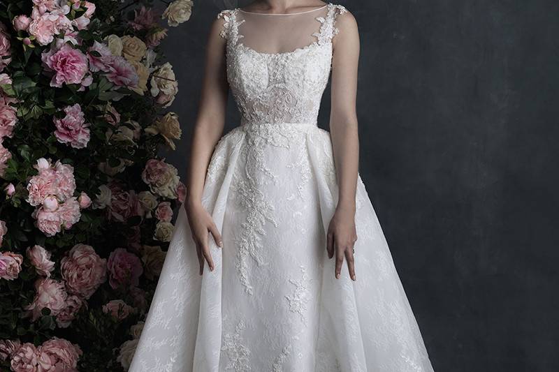 C413	<br>	A play of opaque and transparent floral motifs lend chic texture to this ballgown.