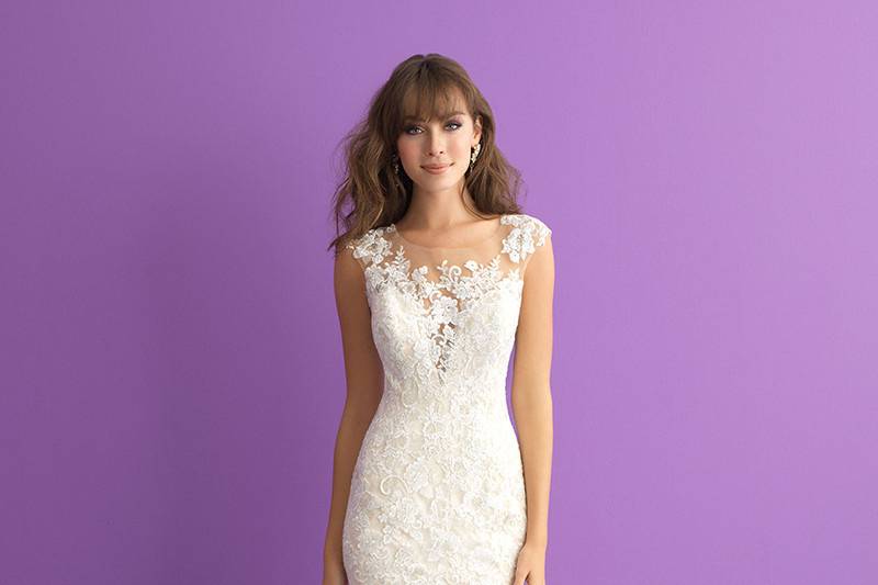 Style 3003		Delicate lace frames the deep sweetheart neckline and illusion back on this cap sleeved gown.