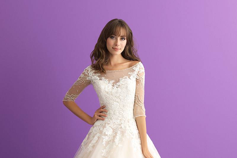 Style 3006		This lace-topped ballgown features a bateau neckline and elbow length sheer sleeves.