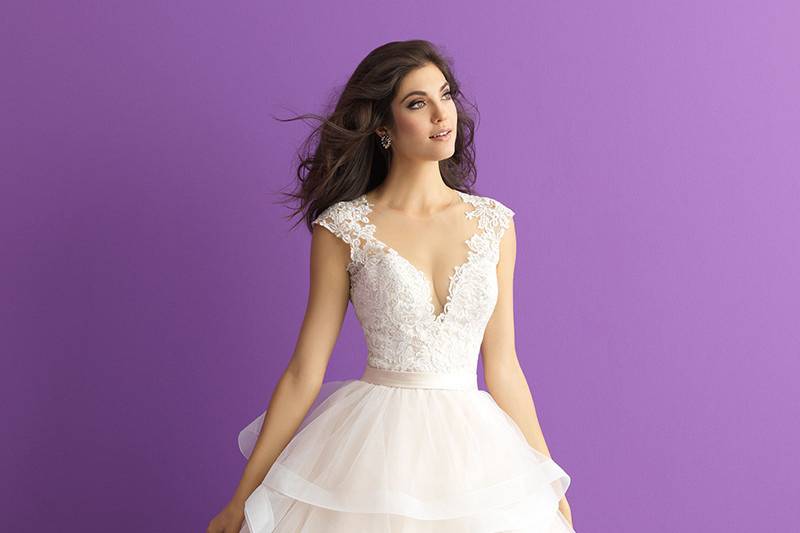 Style 3017		A play of textures defines this ballgown - ranging from ruffles to illusion netting.