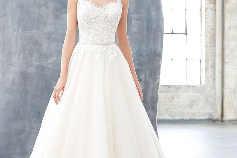 Style MJ304		Sheer illusion netting, lace and tulle: all of our favorite bridal elements in one ballgown.