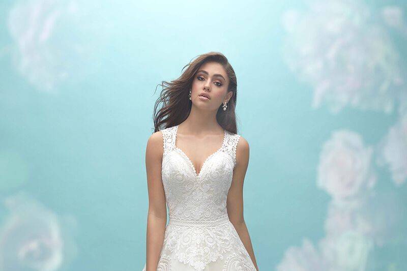 Allure Bridals	9456	<br>	This strapless, ruffled mermaid gown features symmetrical patterned lace across the bodice and train.