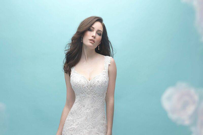 Allure Bridals	9463	<br>	Beaded embroidery trails down the length of this classic sheath gown.