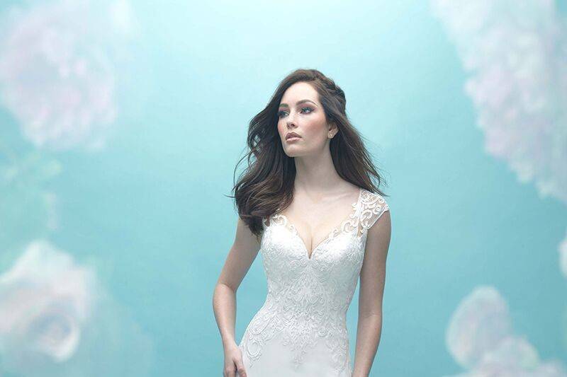 Allure Bridals	9469	<br>	Bold, sheer lace paneling adorns the back and hemline of this lovely crepe gown.