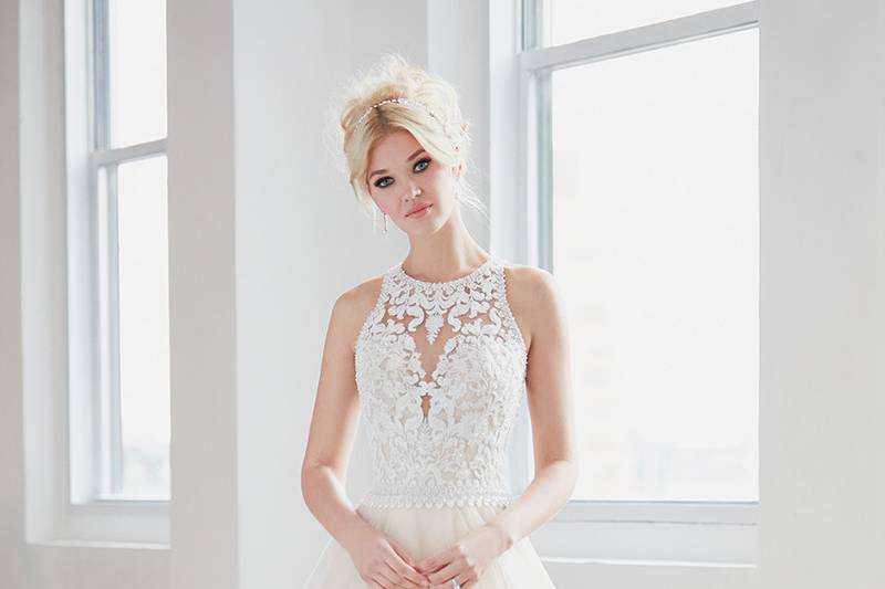 Madison James	MJ352	<br>	Bold beaded embroidery covers an illusion bodice, while a soft tulle skirt balances the look.