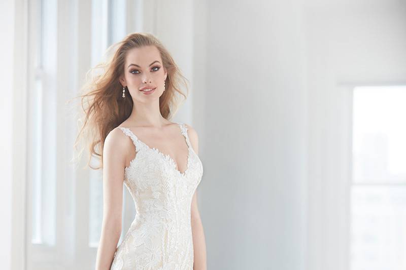 Madison James	MJ352	<br>	Bold beaded embroidery covers an illusion bodice, while a soft tulle skirt balances the look.