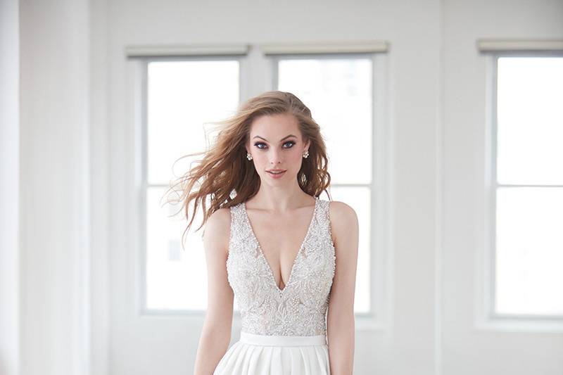 Madison James	MJ357	<br>	Intricate appliques frame the neckline and illusion back of this ethereal sheath gown.