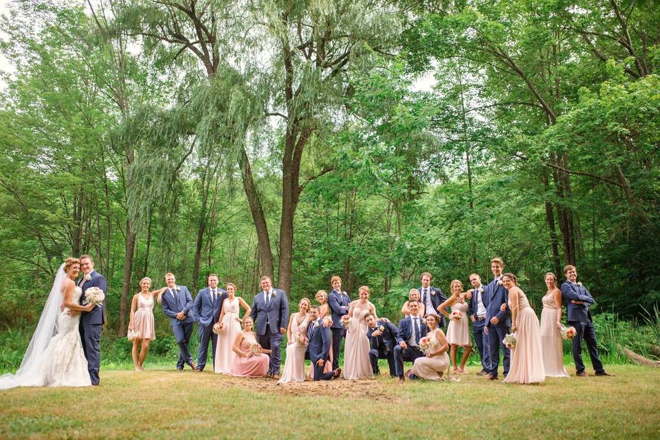 Newlyweds and their guests in the woods