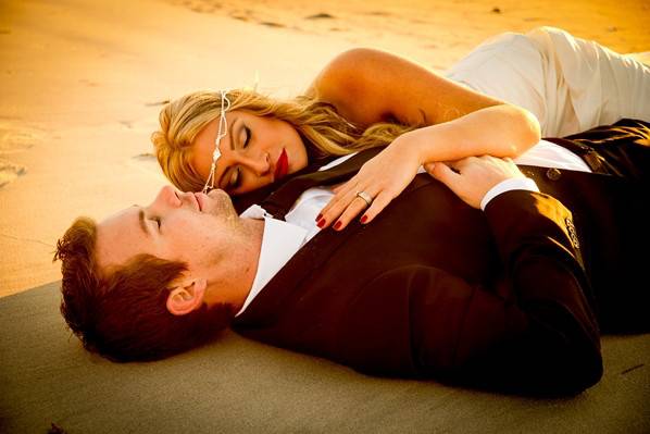 Couple laying on the sand