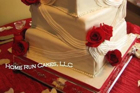 Twisted squares with fondant draping and red roses!