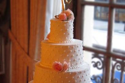 5 tier wedding cake, all buttercreme with quilting and pearl detailing.