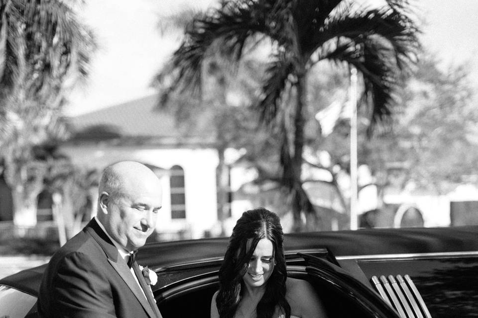 Bride and Black Limousine