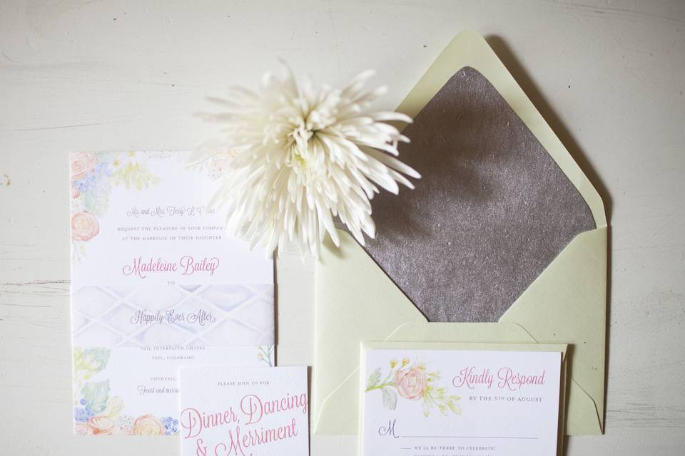 Madeleine and Joe wanted their wedding invitations to feel soft and romantic to excite their guests and set the mood for their big day in Vail, Colorado. We had inner envelopes lined with handmade silver paper and my favorite stand out detail was the ‘happily ever after ‘band we used to tie the suite together.