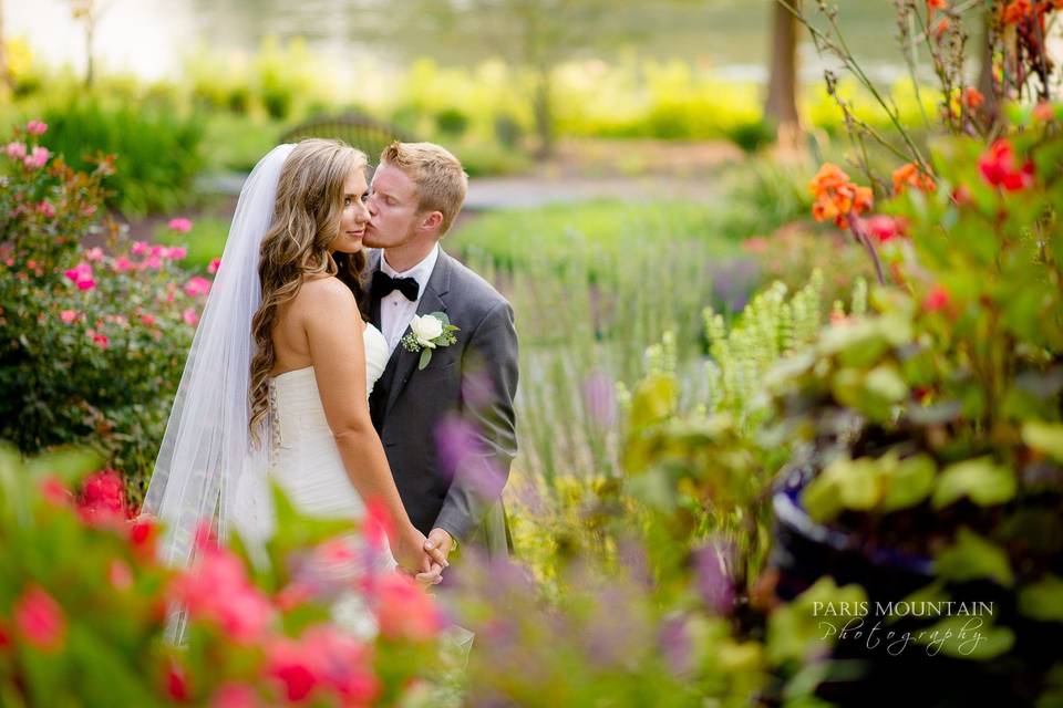 Groom kissing his bride