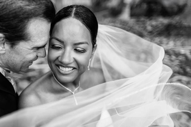 Bride laughing with father