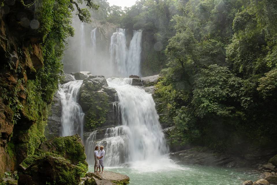 Vows at a jungle waterfall