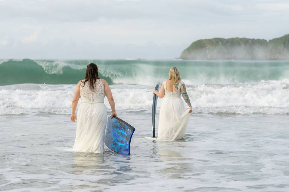 Brides heading into the surf