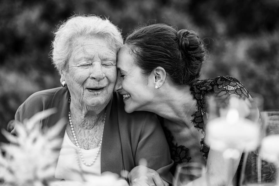 Grandma laughing with family