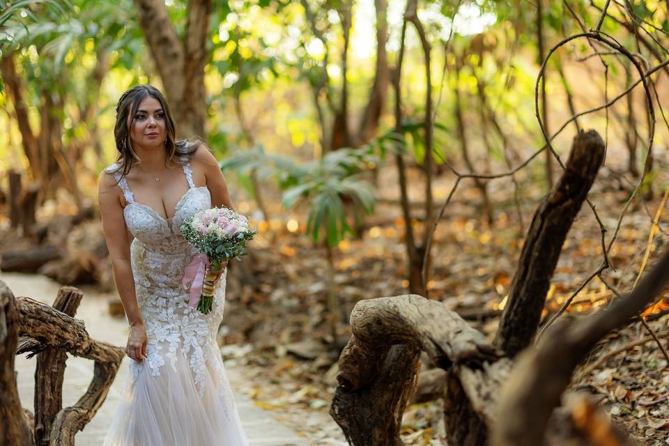 Bride walking a forest path