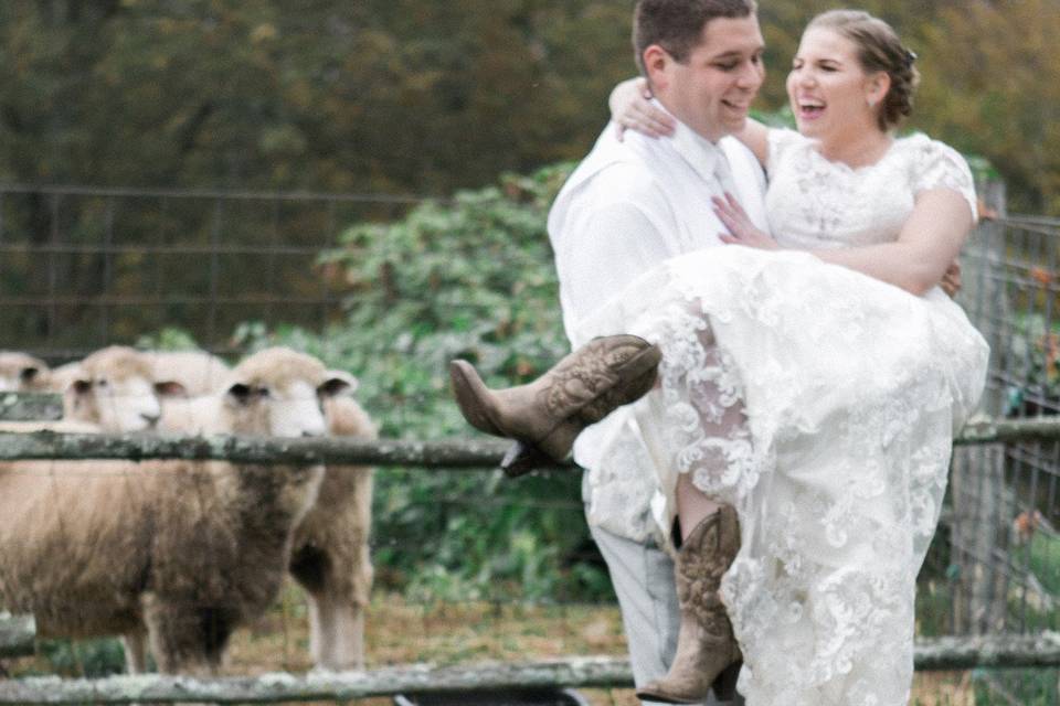 Groom carrying the bride