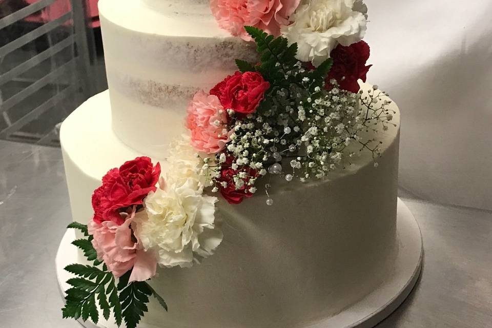 Naked cakes with fresh flowers provided by the bride