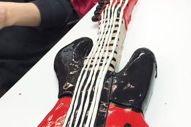 A cake guitar made for the top of a bar mitzvah cake