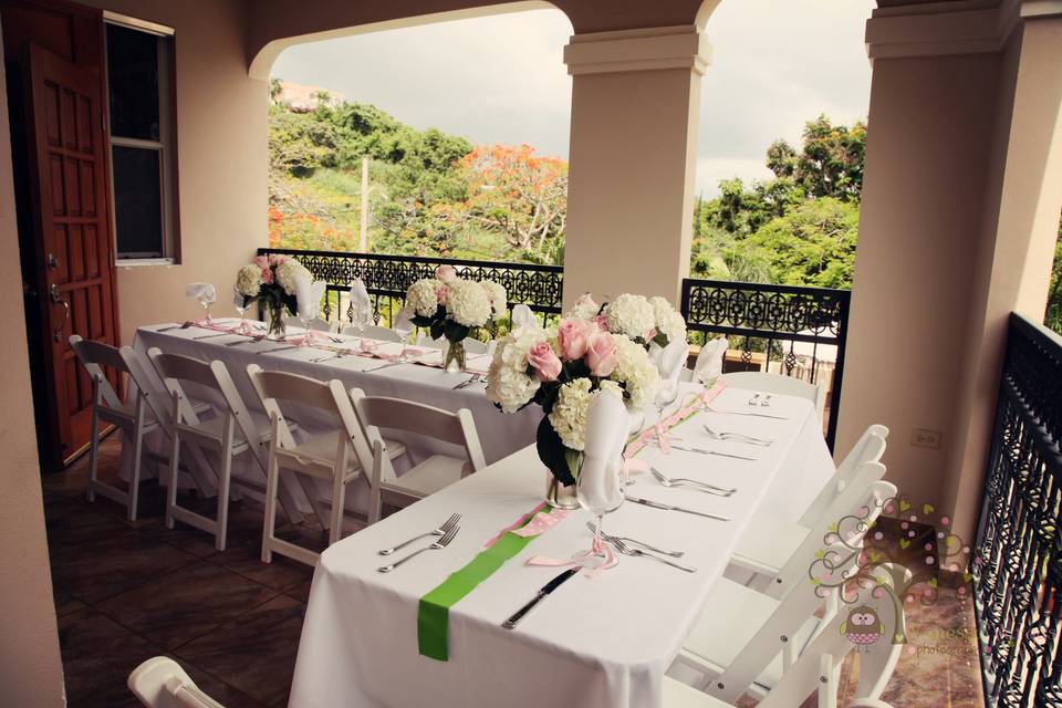 Beautiful table setting for outdoor luncheon at a private villa overlooking the Sea.