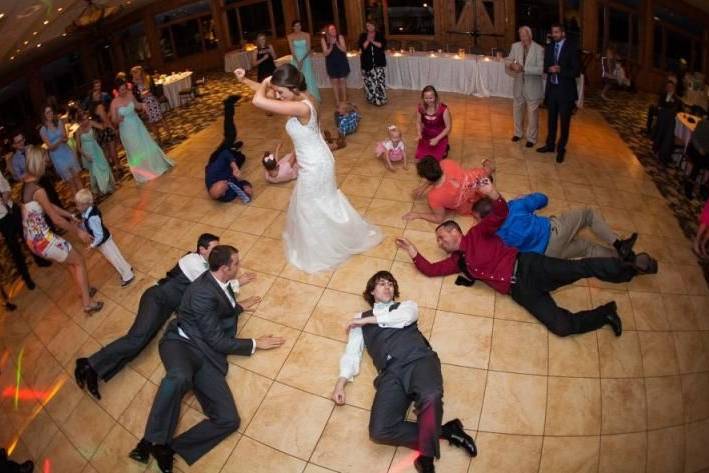 Bride and groomsmen dancing