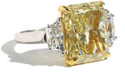 A stunning 8.36 carat VS2 Fancy Yellow Starburst Diamond Ring set in platinum.