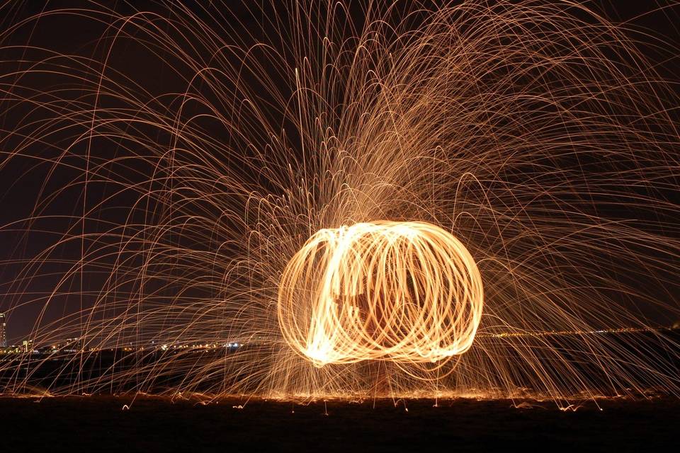 This is not a wedding photo--merely an exhibition of my repertoire. Steel wool photography on Swansea beach in Wales.